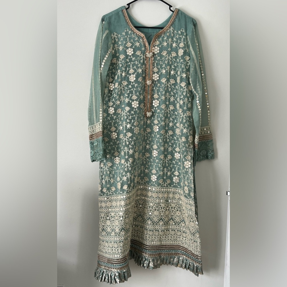 Mint green Net suit chicken kari and foil work. 
Three piece 
Pakistani suit